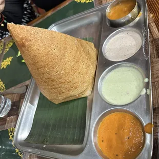a plate of food with sauces