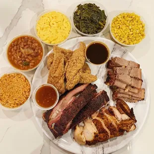 a platter of meat and sides