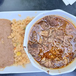 Birria  Beef stew cooked in assorted spices for 10 hours.  Beans were unique.