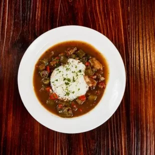 a bowl of stew and rice