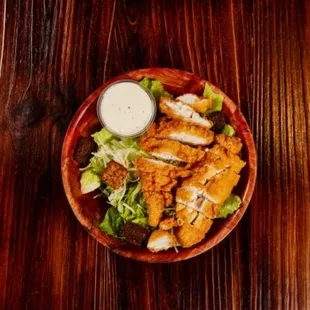 a plate of food on a wooden table