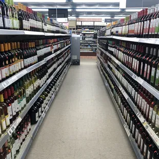 rows of wine bottles in a store