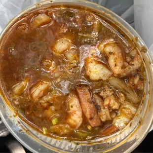 a bowl of gumbo and a spoon