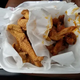 Honey hot wings , catfish, and fries
