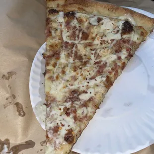 two slices of pizza on a paper plate