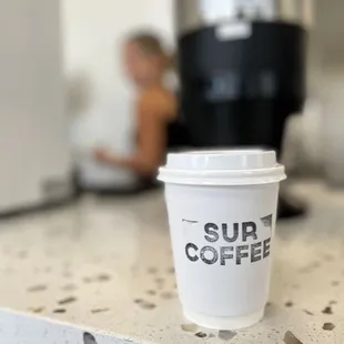 a cup of coffee on a counter