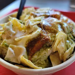 a bowl of food on a red tray