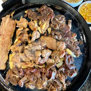 a plate of meat and vegetables