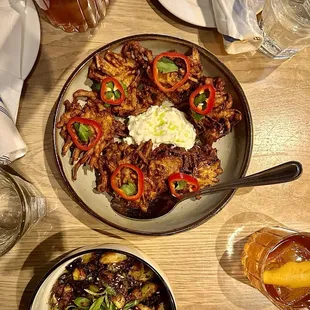 This is the onion bhaji with a delicious tzatziki sauce in the middle. The roasted brussels sprouts are at the bottom of the photo.