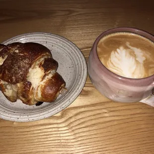 a croissant and a cup of coffee