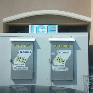 two small bins in front of a store