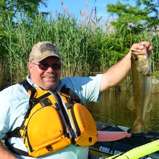 Fish on! Nice catch during a fishing kayak tour.