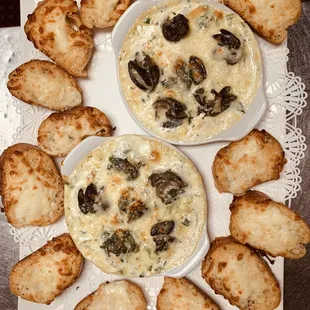 a plate of bread and a bowl of dip