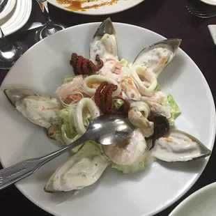 a plate of seafood and salad