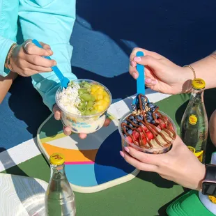 people eating fruit and ice cream