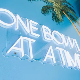 one bowl at a time neon sign