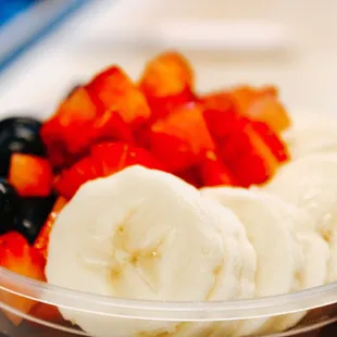 a bowl of fruit and yogurt