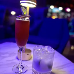 a glass of water and a drink