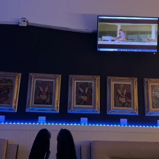 a wall of artwork