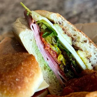 a closeup of a sandwich and chips