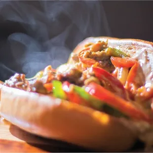 a hot dog with peppers and onions