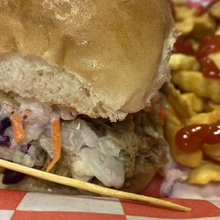 BBQ sandwich with slaw and fries.