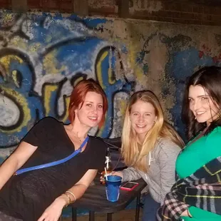 three women sitting at a table