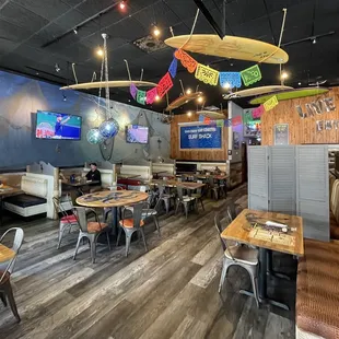 Surfboards hanging from the ceiling, Dining area of Surf Shack