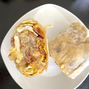 Bacon Breakfast Burrito. Hashbrowns, scrambled eggs, chunks of bacon pieces, and melted cheese. Recommend ordering this.