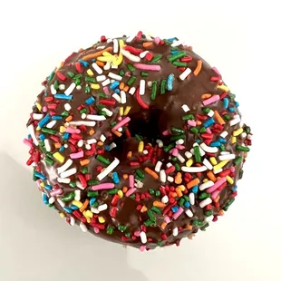Chocolate cake donut with sprinkles.