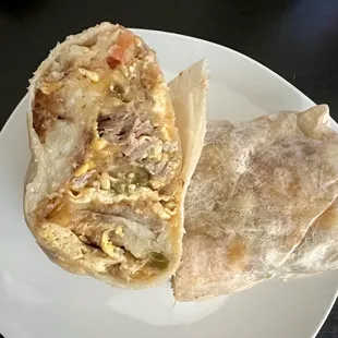 Machaca Breakfast Burrito. Hashbrowns, scrambled eggs, shredded carnitas, and melted cheese. Added jalapeños &amp; onions for $1.50 each.