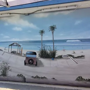 Very cool mural in the back with seating