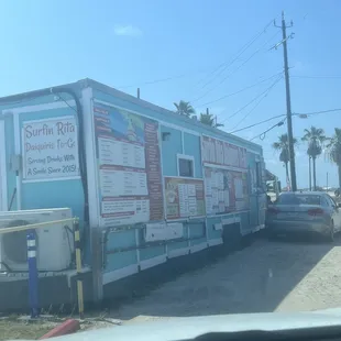 a blue building with signs on it