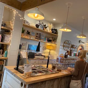  woman and a woman standing at a counter