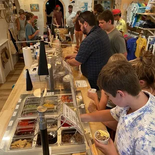 Make your way down the overwhelming number of toppings! Careful it&apos;s by weight!
