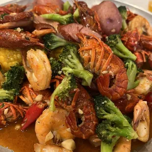 Combo #1 shrimp head off and crawfish medium heat house seasoning added broccoli (fed 2)