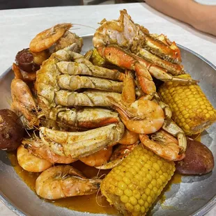 a platter of seafood and corn