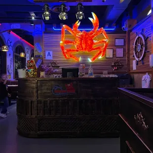 a bar with a neon sign in the background