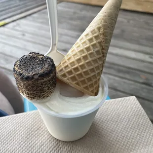 Small Wedding Cake sundae that is topped with a cone and a warm marshmallow
