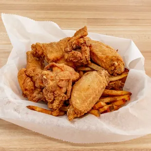 a basket of fried chicken and french fries