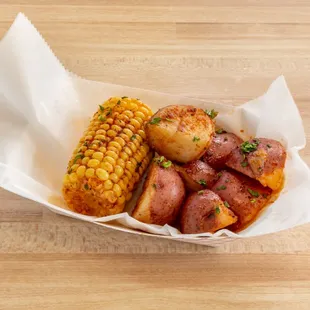 corn and potatoes in a basket