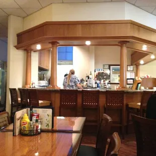 two people sitting at the bar