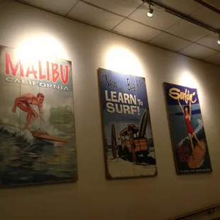 three posters on the wall