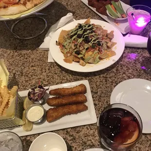 Fish and chips + sangria + chicken nachos + wings