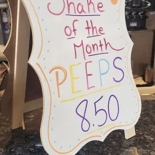 a sign that says shake of the month peps $ 50