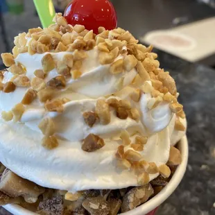 Up close vanilla sundae with caramel and Heath bar crumble's