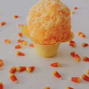 an ice cream cone with candy corn sprinkles