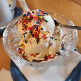 an ice cream sundae with sprinkles