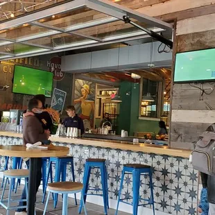 people sitting at tables in a restaurant