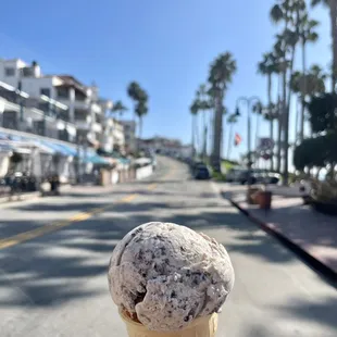 a person holding an ice cream cone